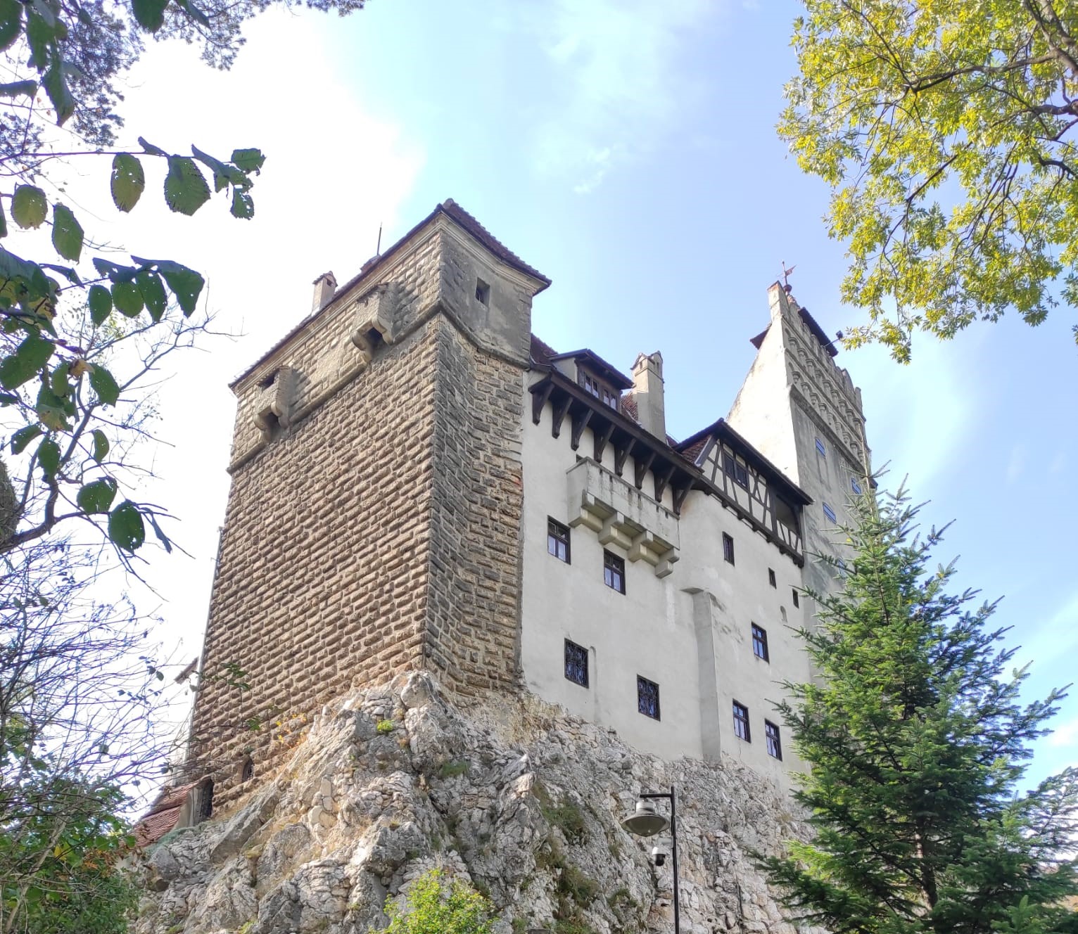 View of Bran Castle rising above the surrounding hills