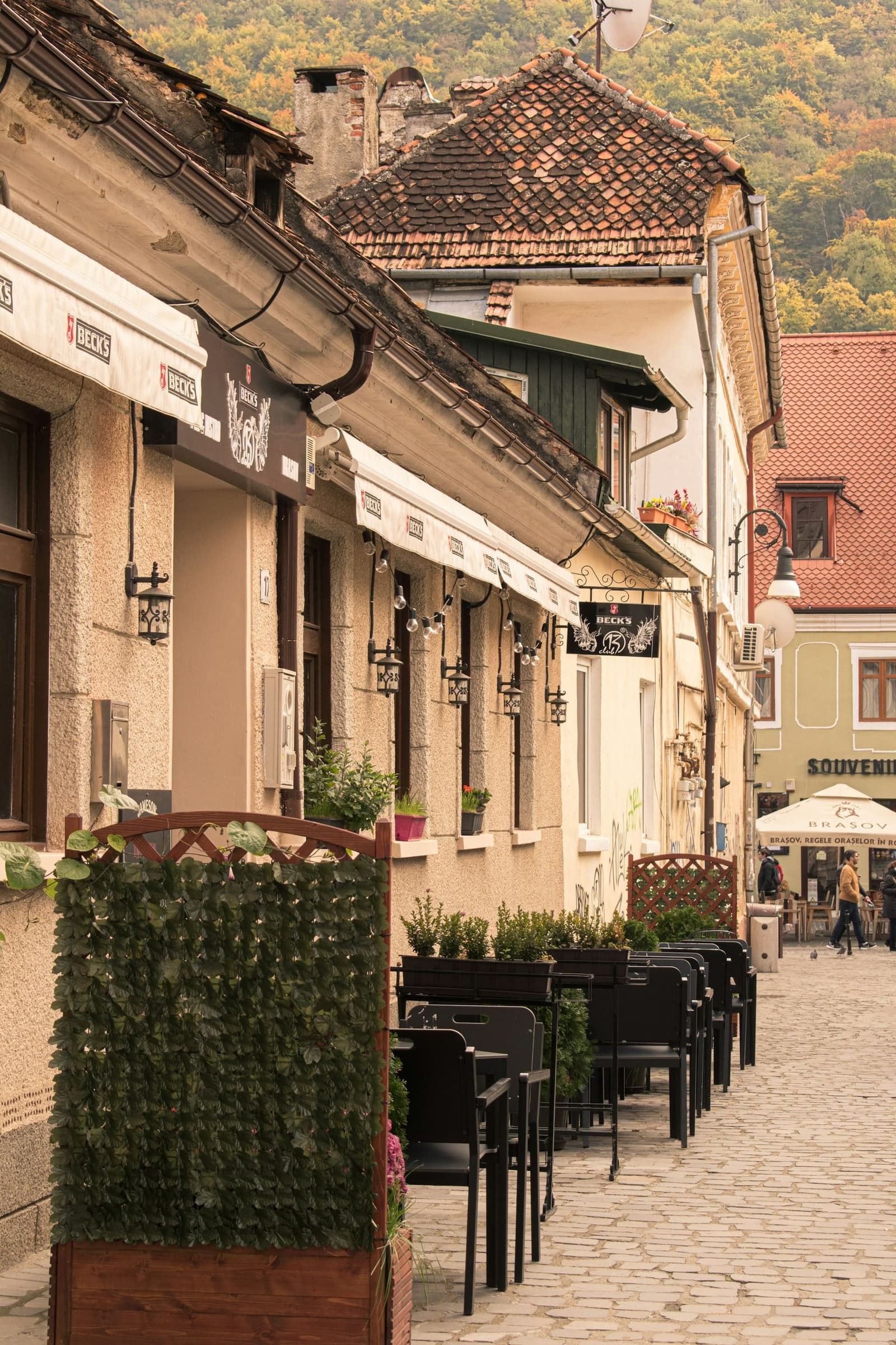 Outdoor seating of a café in Brașov's old town