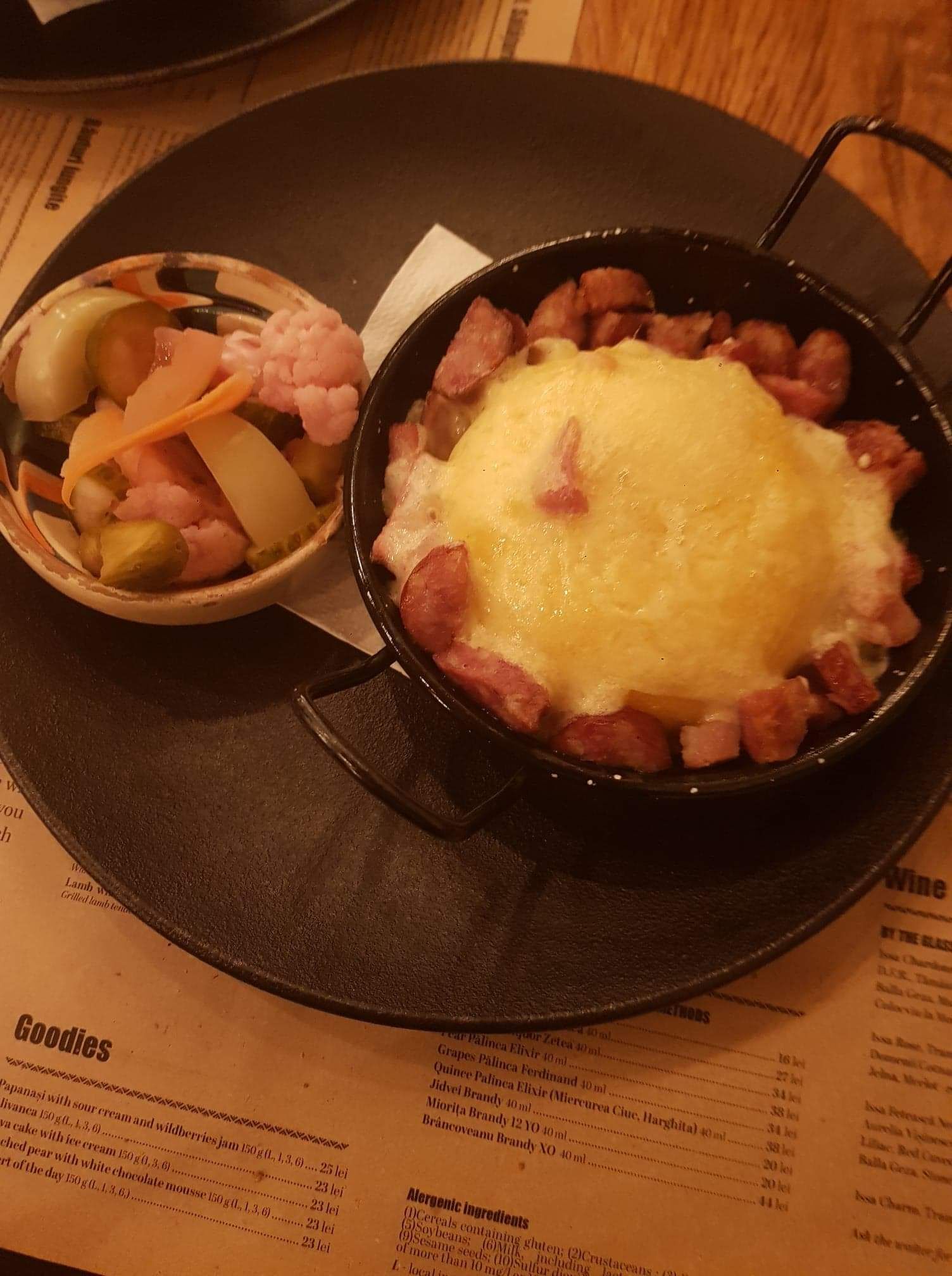 Traditional Transylvanian bulz with pickled vegetables