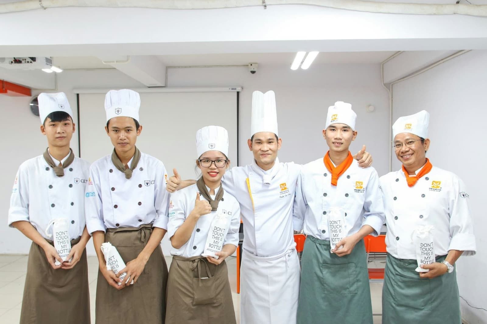 Professional chef team working together in kitchen