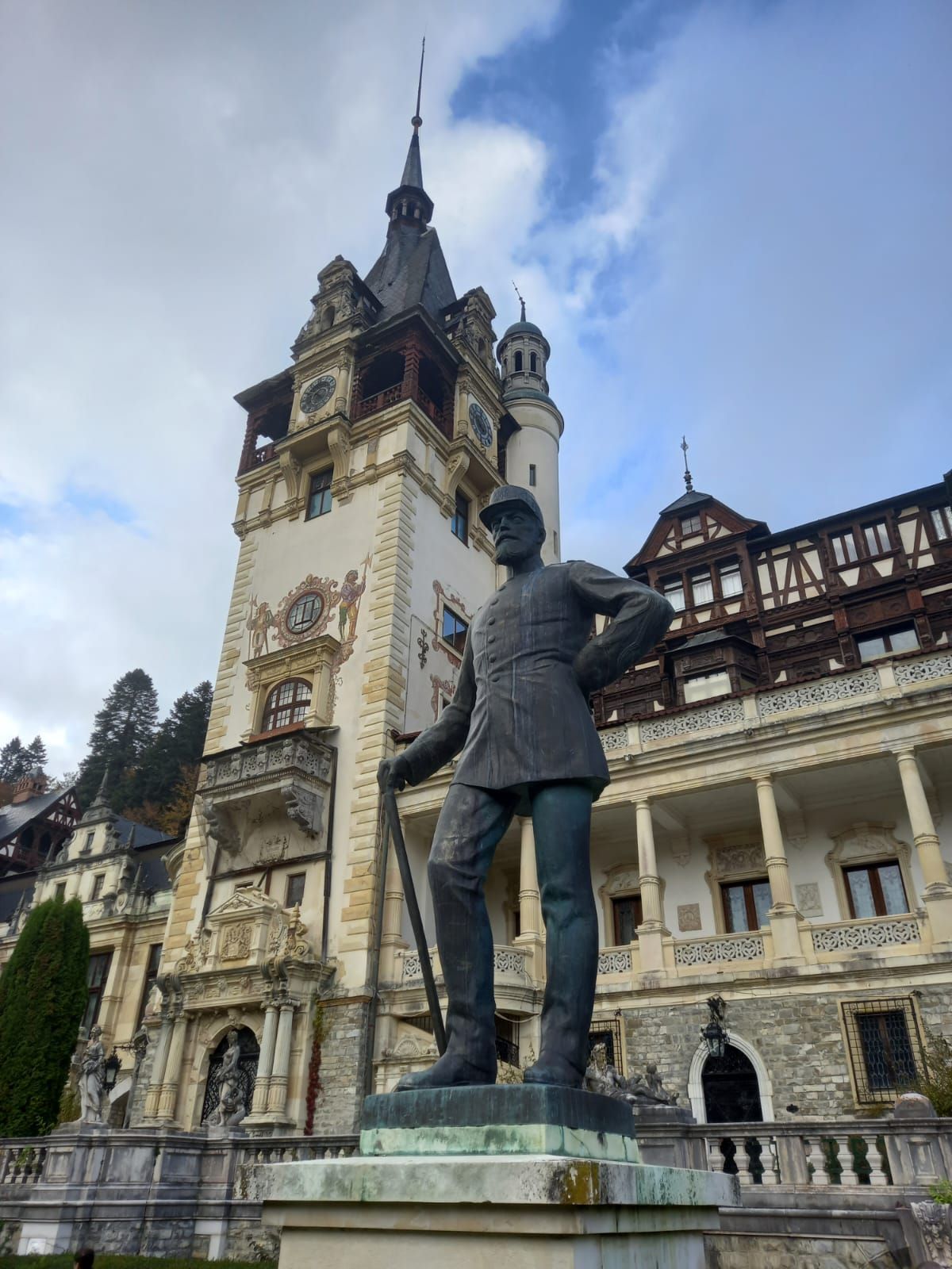 Stone pathway leading toward the ornate entrance of Peleș Castle