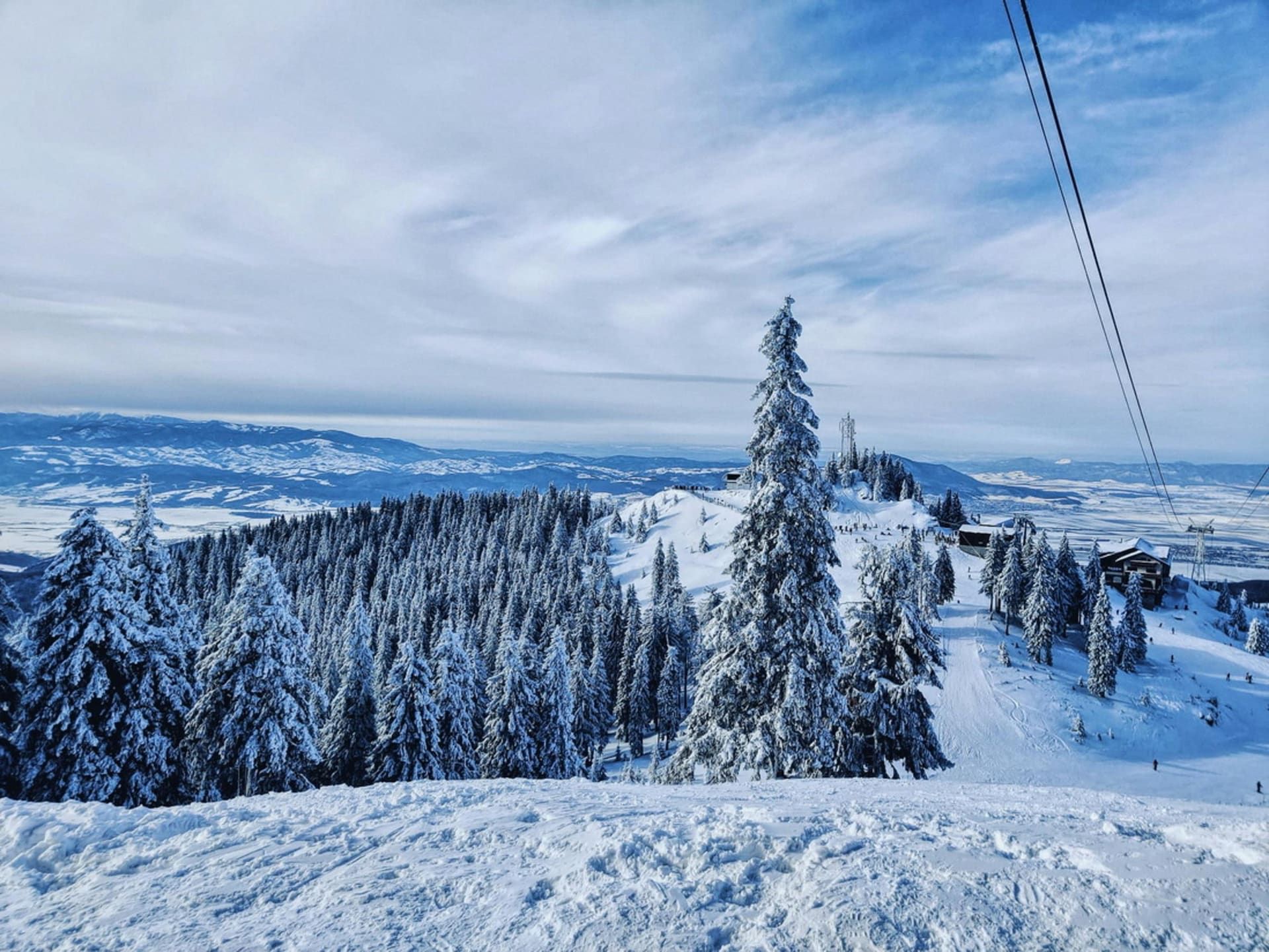 Skier on a perfectly groomed slope in Poiana Brașov