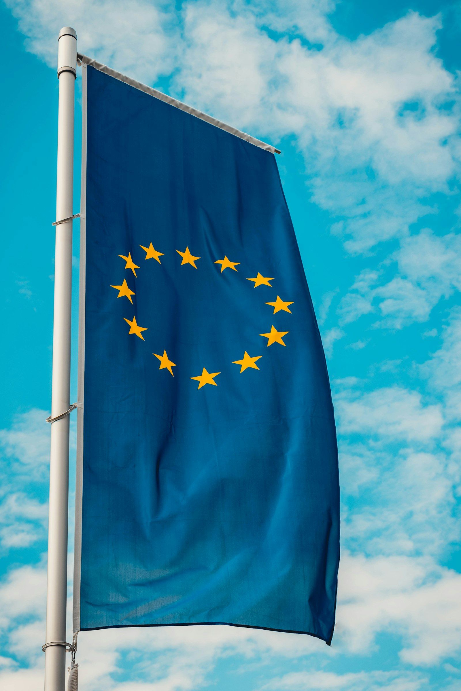 European Union flag waving against a blue sky